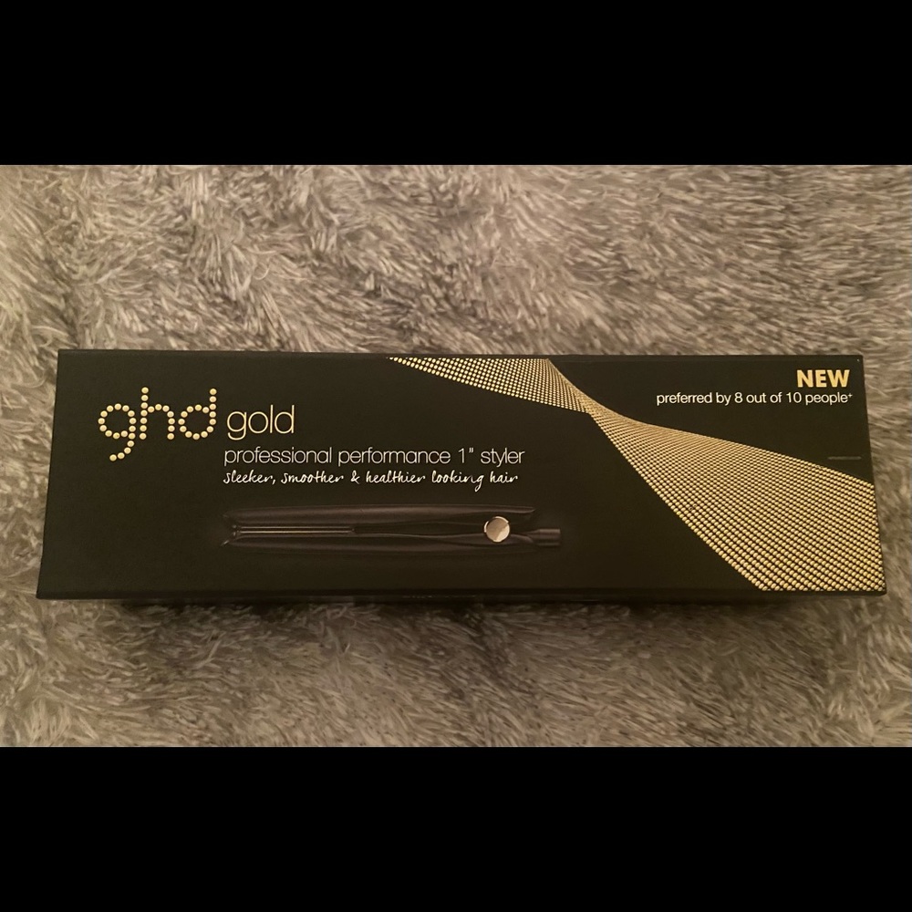 GHD gold flat iron.